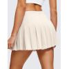 imageCRZ YOGA Cute Pleated Skirts for Women High Waisted Tennis Golf Skorts with Pockets Casual Athletic Workout SkaterWhite Apricot
