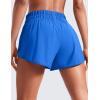 imageCRZ YOGA High Waisted Dolphin Running Shorts for Womens Mesh Liner for Gym Workout Athletic with Zipper PocketSparkle Blue