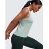 imageCRZ YOGA Seamless Womens Breathable Workout Tank Tops Racerback High Neck Sleeveless Running Athletic ShirtsGreen Palm Court Heather