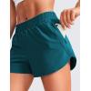 imageCRZ YOGA Womens High Waisted Running Shorts Mesh Liner 3 Dolphin Quick Dry for Athletic Gym Track Workout with Zip PocketBorealis Green