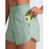 imageCRZ YOGA Womens High Waisted Running Shorts Mesh Liner 3 Dolphin Quick Dry for Athletic Gym Track Workout with Zip PocketGreen Palm Court