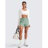 imageCRZ YOGA Womens High Waisted Running Shorts Mesh Liner 3 Dolphin Quick Dry for Athletic Gym Track Workout with Zip PocketGreen Palm Court