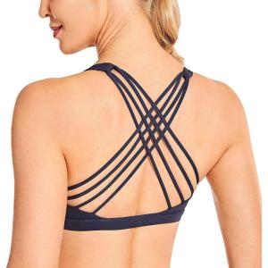 imageCRZ YOGA Strappy Sports Bras for Women  Criss Cross Back Wireless Padded Yoga Workout Cami TopNavy