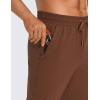 imageCRZ YOGA Athletic Joggers for Men Lightweight Water Resistant Outdoor Workout Pants with Zip PocketsDark Brown