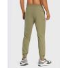 imageCRZ YOGA Athletic Joggers for Men Lightweight Water Resistant Outdoor Workout Pants with Zip PocketsMoss Green