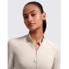 imageCRZ YOGA Butterluxe Womens Cropped Slim Fit Workout Jacket Weightless Track Athletic Full Zip Up Tops with Thumb HolesMojave Tan