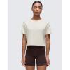 imageCRZ YOGA Open Back Short Sleeve Crop Top for Women Loose Athletic Yoga Workout Shirts Casual Cropped TShirtsWhite Apricot