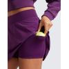 imageCRZ YOGA Tennis Skirt for Women High Waisted Flowy Golf Pickleball Athletic Casual A Line Skorts with PocketsPlum Magenta