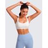 imageCRZ YOGA Womens Light Support Strappy Sports Bra  Low Cut Wirefree Padded Yoga Cami Criss Cross BackWhite Apricot