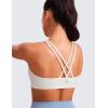 imageCRZ YOGA Womens Light Support Strappy Sports Bra  Low Cut Wirefree Padded Yoga Cami Criss Cross BackWhite Apricot