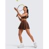 imageCRZ YOGA Womens Mini Pleated Athletic Tennis Skirts High Waisted A Line Golf Pickleball Casual Skort with Inner PocketsCoffee Brown
