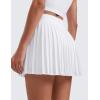 imageCRZ YOGA Womens Mini Pleated Athletic Tennis Skirts High Waisted A Line Golf Pickleball Casual Skort with Inner PocketsWhite