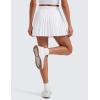 imageCRZ YOGA Womens Mini Pleated Athletic Tennis Skirts High Waisted A Line Golf Pickleball Casual Skort with Inner PocketsWhite