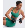 imageCRZ YOGA Womens Strappy Sports Bra  Criss Cross Back Padded Medium Support Wireless Gym Cami Workout YogaCascadia Green