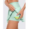 imageCRZ YOGA Womens High Waisted Pleated Tennis Skirts with Pockets Tummy Control Casual Liner A Line Workout Golf SkortsMint Moment