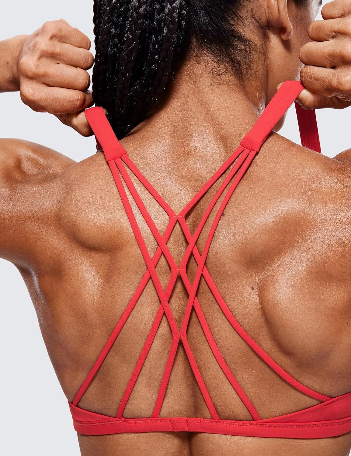 imageCRZ YOGA Womens Strappy Sports Bra  Criss Cross Back Padded Medium Support Wireless Gym Cami Workout YogaCrimson