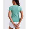 imageCRZ YOGA Seamless Workout Tops for Women Hip Length  Athletic Running Gym Yoga Short Sleeve Shirts Breathable Crewneck TeesCascadia Green Heather