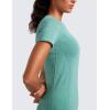 imageCRZ YOGA Seamless Workout Tops for Women Hip Length  Athletic Running Gym Yoga Short Sleeve Shirts Breathable Crewneck TeesCascadia Green Heather