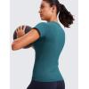 imageCRZ YOGA Seamless Workout Tops for Women Hip Length  Athletic Running Gym Yoga Short Sleeve Shirts Breathable Crewneck TeesGreen Jade