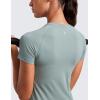 imageCRZ YOGA Seamless Workout Tops for Women Hip Length  Athletic Running Gym Yoga Short Sleeve Shirts Breathable Crewneck TeesGreen Palm Court