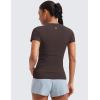imageCRZ YOGA Seamless Workout Tops for Women Hip Length  Athletic Running Gym Yoga Short Sleeve Shirts Breathable Crewneck TeesHot Fudge Brown