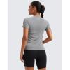imageCRZ YOGA Seamless Workout Tops for Women Hip Length  Athletic Running Gym Yoga Short Sleeve Shirts Breathable Crewneck TeesSlate Grey Marl