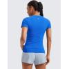 imageCRZ YOGA Seamless Workout Tops for Women Hip Length  Athletic Running Gym Yoga Short Sleeve Shirts Breathable Crewneck TeesSparkle Blue