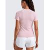 imageCRZ YOGA Seamless Workout Tops for Women Hip Length  Athletic Running Gym Yoga Short Sleeve Shirts Breathable Crewneck TeesStrawberry Pink