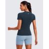 imageCRZ YOGA Seamless Workout Tops for Women Hip Length  Athletic Running Gym Yoga Short Sleeve Shirts Breathable Crewneck TeesTwilight Blue