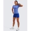 imageCRZ YOGA Seamless Workout Tops for Women Hip Length  Athletic Running Gym Yoga Short Sleeve Shirts Breathable Crewneck TeesWild Indigo