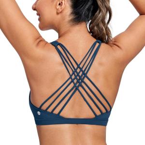 imageCRZ YOGA Naked Feeling Strappy Sports Bras for Women  Criss Cross Back Wireless Padded Cami Yoga Workout TopFrench Navy