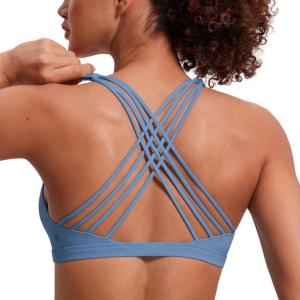 imageCRZ YOGA Naked Feeling Strappy Sports Bras for Women  Criss Cross Back Wireless Padded Cami Yoga Workout TopOasis Blue