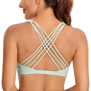 imageCRZ YOGA Naked Feeling Strappy Sports Bras for Women  Criss Cross Back Wireless Padded Cami Yoga Workout TopPale Straw Green