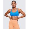 imageCRZ YOGA Womens Naked Feeling Criss Cross Sports Bra  Strappy Back Padded Medium Support Wireless Gym Cami Workout YogaMadagascar Blue
