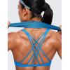 imageCRZ YOGA Womens Naked Feeling Criss Cross Sports Bra  Strappy Back Padded Medium Support Wireless Gym Cami Workout YogaMadagascar Blue