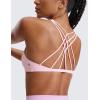 imageCRZ YOGA Womens Naked Feeling Criss Cross Sports Bra  Strappy Back Padded Medium Support Wireless Gym Cami Workout YogaStrawberry Pink