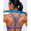 imageCRZ YOGA Womens Naked Feeling Criss Cross Sports Bra  Strappy Back Padded Medium Support Wireless Gym Cami Workout YogaWaves Blue