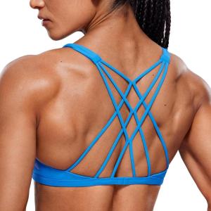 imageCRZ YOGA Womens Naked Feeling Criss Cross Sports Bra  Strappy Back Padded Medium Support Wireless Gym Cami Workout YogaMadagascar Blue