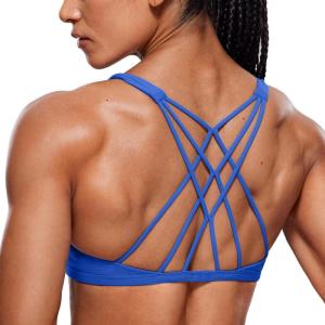 imageCRZ YOGA Womens Naked Feeling Criss Cross Sports Bra  Strappy Back Padded Medium Support Wireless Gym Cami Workout YogaWaves Blue