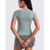 imageCRZ YOGA Seamless Workout Tops for Women Waist Length  Running Gym Athletic Yoga Short Sleeve Shirts Breathable CrewneckGreen Palm Court