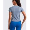 imageCRZ YOGA Seamless Workout Tops for Women Waist Length  Running Gym Athletic Yoga Short Sleeve Shirts Breathable CrewneckOasis Blue Heather