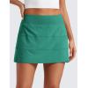imageCRZ YOGA High Waisted A line Golf Skirts for Women  Mini Lined Tennis Casual Work Skorts with 3 PocketsCascadia Green