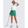 imageCRZ YOGA High Waisted A line Golf Skirts for Women  Mini Lined Tennis Casual Work Skorts with 3 PocketsCascadia Green