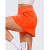 imageCRZ YOGA High Waisted A line Golf Skirts for Women  Mini Lined Tennis Casual Work Skorts with 3 PocketsNeon Orange