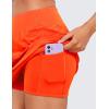 imageCRZ YOGA High Waisted A line Golf Skirts for Women  Mini Lined Tennis Casual Work Skorts with 3 PocketsNeon Orange