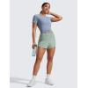 imageCRZ YOGA High Waisted Running Shorts for Women 25  Mesh Liner Quick Dry for Workout Sport Athletic with Zipper PocketGreen Palm Court