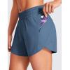 imageCRZ YOGA Dolphin Athletic Shorts for Women 5  High Waisted Quick Dry for Running Workout Gym Track with Zip PocketStelindigo Blue