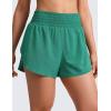 imageCRZ YOGA Split Dolphin Running Shorts for Women 25  Curved Back High Waisted Quick Dry for Athletic Workout Gym TrackCascadia Green