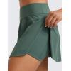 imageCRZ YOGA High Waisted Side Slit Tennis Skirts for Women  Mini Lined A Line Running Athletic Skort with Inner PocketsDark Forest Green