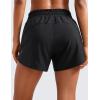 imageCRZ YOGA Dolphin Athletic Shorts for Women 5  Mid Waisted Quick Dry for Running Workout Gym Track with Zip PocketBlack